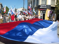 Crimean people celebrate reunification with Russian happy celebrations big Russian flag